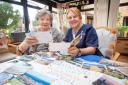 Violet McColl (left) and Lorraine Douglas sift through the postcards