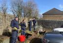 Distillery workers help get charity gardens back into shape