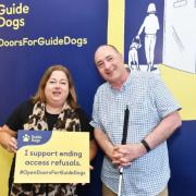 MP Kirsten Oswald with Pete Bungay, a guide dog owner