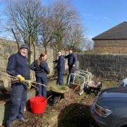 Distillery workers help get charity gardens back into shape