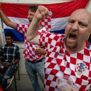 Croatian football fans cheer before the England game