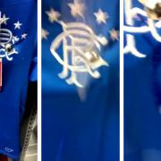 Disgusting moment Celtic fan SPITS on Rangers top in sports shop