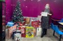 Alexis Maitland, from Women’s Aid, with the donated gifts