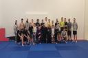 Members of Barrhead Community Muay Thai Boxing Club take a bow