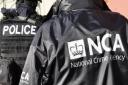 Officers from the National Crime Agency and Police Scotland's Organised Crime Partnership swooped on a house in Barrhead