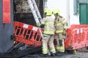 Fire crews deal with the aftermath of a fire on Buck Street, Bradford