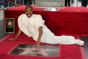 Billy Porter sits next to his Hollywood Star