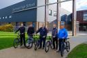 Steven Rutherford (right) with members of the bike repair team during their visit to Barrhead High School