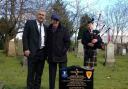 Tony Onslow, centre, with Everton legend Ian Snodin at the grave of another former player, Andrew Hannah