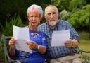 East Renfrewshire couple Linda and Mervyn Lovat with their coronavirus vaccination certificates