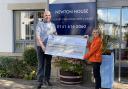 David Holbrook, regional community relations lead at Newton House, hands the cheque to Lesley Giudici, of Glasgow’s Golden Generation