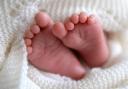 A newborn baby’s feet as a new report shows a rise in success from fertility treatment (Andrew Matthews/PA)