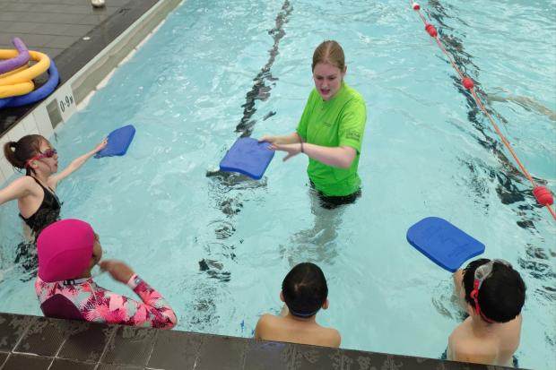 Swim instructor Emily Greeves with a class