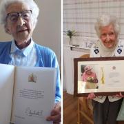 Anna Lawns (left) with her birthday card from The Queen and Hannah Gebbie (right) with her telegraph on her 100th birthday
