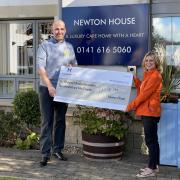 David Holbrook, regional community relations lead at Newton House, hands the cheque to Lesley Giudici, of Glasgow’s Golden Generation