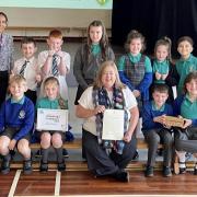 Kirsten Oswald with staff and pupils at Hillview Primary School