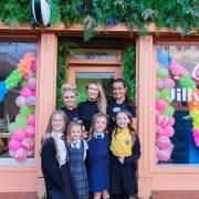 Jill Loney (centre) with stylists Shannon Campbell (left) and Maria Quigley, as well as pupils from the primary schools that will benefit
