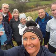 Anwar, second from right, is leading the Neilston Well Walks