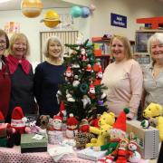 Members of the Neilston Knit and Natter group with some of the items that are available for sale