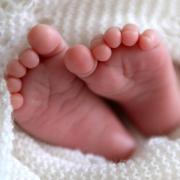 A newborn baby’s feet as a new report shows a rise in success from fertility treatment (Andrew Matthews/PA)