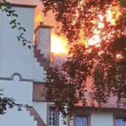 999 crews still battling huge blaze at historic hotel