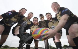 From left: Raptors rugby members Marc Wook, Frankie Miller, Andrew Fry, performer Ziggi Battles,  Ross Lockerbie and Brian McGraw at Clydebank Social Hub where a drag fundraiser will take place. Picture: Gordon Terris