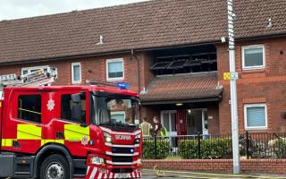 Woman dies after fire breaks out at property